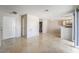 Bright living space with tile floors, neutral walls, and partial view of an open kitchen at 3150 Soft Breezes Dr # 1216, Las Vegas, NV 89128