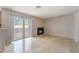 Inviting living area features tile flooring, natural light, and a cozy corner fireplace at 3150 Soft Breezes Dr # 1216, Las Vegas, NV 89128