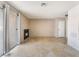 Living area with tile flooring, sliding glass door, corner fireplace, and neutral wall color at 3150 Soft Breezes Dr # 1216, Las Vegas, NV 89128