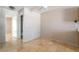 Living room with tile floors and open access to bathroom and dining areas at 3150 Soft Breezes Dr # 1216, Las Vegas, NV 89128