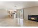 Open-concept living room with tile floors, fireplace, and open access to the kitchen at 3150 Soft Breezes Dr # 1216, Las Vegas, NV 89128