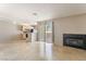 Open-concept living room with tile floors, fireplace, and open access to the kitchen at 3150 Soft Breezes Dr # 1216, Las Vegas, NV 89128