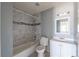 Bathroom featuring tiled shower and new fixtures at 321 Princess Ave, North Las Vegas, NV 89030