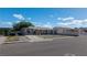 Charming single-story home featuring a gray exterior, a concrete driveway, and low maintenance landscaping at 321 Princess Ave, North Las Vegas, NV 89030