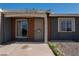 Close-up of the front entrance highlighting the security door and brick accents at 321 Princess Ave, North Las Vegas, NV 89030