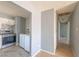 Kitchen with stainless steel appliances including oven and over-the-range microwave, plus a washer and dryer at 321 Princess Ave, North Las Vegas, NV 89030