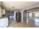 Kitchen with appliances adjacent to a laundry area and a view into the living space at 321 Princess Ave, North Las Vegas, NV 89030