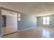 Bright living room area featuring hardwood floors and windows at 321 Princess Ave, North Las Vegas, NV 89030