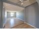 Open living room featuring hardwood floors and a ceiling fan at 321 Princess Ave, North Las Vegas, NV 89030