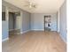 Open floor plan showing a large living room, light grey walls, and an entrance to the kitchen at 321 Princess Ave, North Las Vegas, NV 89030