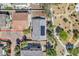 Aerial view showcasing a well-maintained roof with solar panels in a neighborhood close to a walking path at 3521 Discovery Downs Ct, North Las Vegas, NV 89081