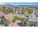 Gorgeous aerial view of a community with green spaces, showing proximity to neighborhood amenities at 3521 Discovery Downs Ct, North Las Vegas, NV 89081