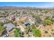 Community aerial view showcases lush landscaping and many homes at 3521 Discovery Downs Ct, North Las Vegas, NV 89081