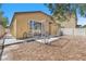 Fenced backyard with desert landscaping, covered patio, and hardscape at 3521 Discovery Downs Ct, North Las Vegas, NV 89081