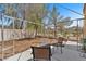 Fenced-in backyard with desert landscaping, covered patio, and seating at 3521 Discovery Downs Ct, North Las Vegas, NV 89081