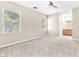 Spacious bedroom with carpet, ceiling fan, neutral paint, and lots of natural light at 3521 Discovery Downs Ct, North Las Vegas, NV 89081