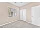 This bedroom features neutral walls and carpet, bright natural light and dual door closet at 3521 Discovery Downs Ct, North Las Vegas, NV 89081