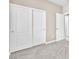 This bedroom has neutral carpet and a double closet at 3521 Discovery Downs Ct, North Las Vegas, NV 89081