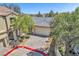 Aerial view of charming home with manicured landscaping and brick driveway at 3521 Discovery Downs Ct, North Las Vegas, NV 89081
