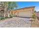 Charming home with a two-car garage and brick driveway at 3521 Discovery Downs Ct, North Las Vegas, NV 89081