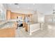 Bright kitchen features granite counters, stainless appliances, and a center island with room for seating at 3521 Discovery Downs Ct, North Las Vegas, NV 89081
