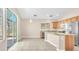 Open-concept kitchen with granite counters, stainless appliances, and access to the outdoor patio at 3521 Discovery Downs Ct, North Las Vegas, NV 89081