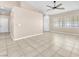 Spacious and bright living space featuring tile floors, large windows, and a door at 3521 Discovery Downs Ct, North Las Vegas, NV 89081