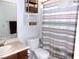 Cozy bathroom featuring a stylish vanity and striped shower curtain, offering a comfortable and functional space at 3720 Desert Marina Dr # 33, Laughlin, NV 89029