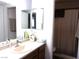 Bathroom featuring a vanity with a mirror and a shower/tub combo with curtain at 3720 Desert Marina Dr # 33, Laughlin, NV 89029