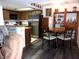Eat in kitchen featuring stainless steel refrigerator, wood cabinets, and modern flooring at 3720 Desert Marina Dr # 33, Laughlin, NV 89029