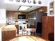 Kitchen with wood cabinets, stainless steel refrigerator, and eat-in table at 3720 Desert Marina Dr # 33, Laughlin, NV 89029