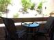 Inviting patio seating area with a round glass table, perfect for relaxing outdoors with a serene view at 3720 Desert Marina Dr # 33, Laughlin, NV 89029