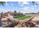 Fenced backyard with artificial turf lawn, patio, and space for landscaping; perfect for outdoor enjoyment at 421 Carlin Ave, Las Vegas, NV 89110