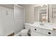 Clean bathroom with a walk-in shower, white fixtures, and a well-lit vanity area at 421 Carlin Ave, Las Vegas, NV 89110