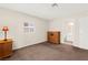 This bedroom has neutral walls, carpet flooring, and an attached bathroom at 421 Carlin Ave, Las Vegas, NV 89110