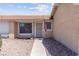 Close-up view of the front entrance with desert landscaping and inviting curb appeal at 421 Carlin Ave, Las Vegas, NV 89110