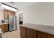 This kitchen features wood cabinets, stainless steel refrigerator, and ample counter space at 421 Carlin Ave, Las Vegas, NV 89110