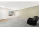 Spacious living room with ample natural light, neutral walls, and comfortable seating arrangement at 421 Carlin Ave, Las Vegas, NV 89110
