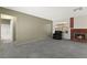 Comfortable living room featuring neutral walls, a cozy fireplace, and a view into the bathroom at 421 Carlin Ave, Las Vegas, NV 89110
