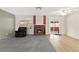 Inviting living room featuring a cozy fireplace, comfortable seating, and access to the sunroom at 421 Carlin Ave, Las Vegas, NV 89110