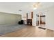 A living room featuring a brick fireplace, neutral colors, and a sliding glass door at 421 Carlin Ave, Las Vegas, NV 89110