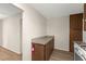 Walkway featuring pantry cabinets, countertops, and light hard wood floors at 421 Carlin Ave, Las Vegas, NV 89110