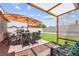 Outdoor patio area with seating, brick pavers, and a covered space for entertaining at 421 Carlin Ave, Las Vegas, NV 89110