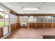 The sun room is enclosed with windows and has laminate flooring at 421 Carlin Ave, Las Vegas, NV 89110