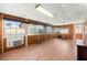 The sun room is enclosed with windows and has laminate flooring at 421 Carlin Ave, Las Vegas, NV 89110