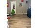 Modestly sized bedroom with wood-style flooring and colorful wall decor at 4363 Pittsfield St, Las Vegas, NV 89115