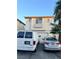 Two-story home with desert landscaping, white garage door, and two parked cars in the driveway at 4363 Pittsfield St, Las Vegas, NV 89115