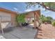 Backyard covered patio featuring a shady space with a swing and lush landscaping at 452 Waterwheel Falls Dr, Henderson, NV 89015
