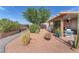 Beautiful backyard featuring mature landscaping, patio, and desert-friendly ground cover at 452 Waterwheel Falls Dr, Henderson, NV 89015