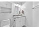 Bathroom featuring a vanity with a mirror and storage, along with a toilet and waste bin at 452 Waterwheel Falls Dr, Henderson, NV 89015